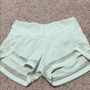 White lululemon shorts with mesh cut outs